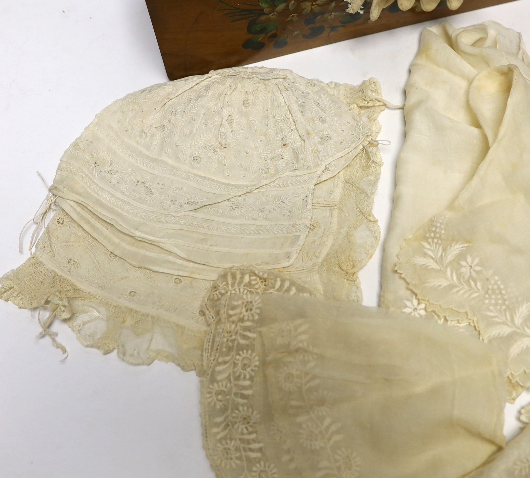 A pair of early 20th century quilted baby shoes, a pair of baby’s gloves, a lady’s pair of pink leather gloves and a collection of fine lawn white worked collars